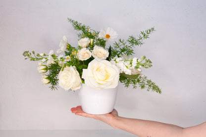 Classic dainty garden arrangement with white florals.