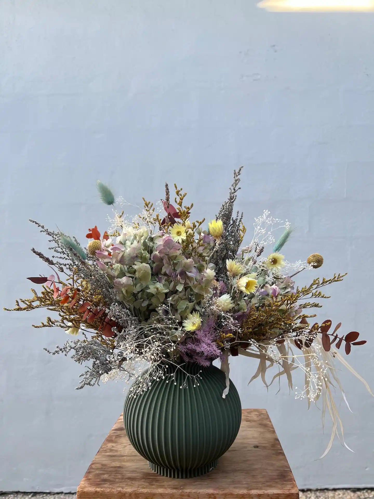 Bleached and dried floral arrangement