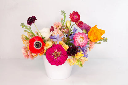 Deluxe garden flower arrangement with colorful and bright flowers.