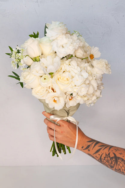 Large neutral wrapped bouquet from a flower delivery shop in Austin, Texas.