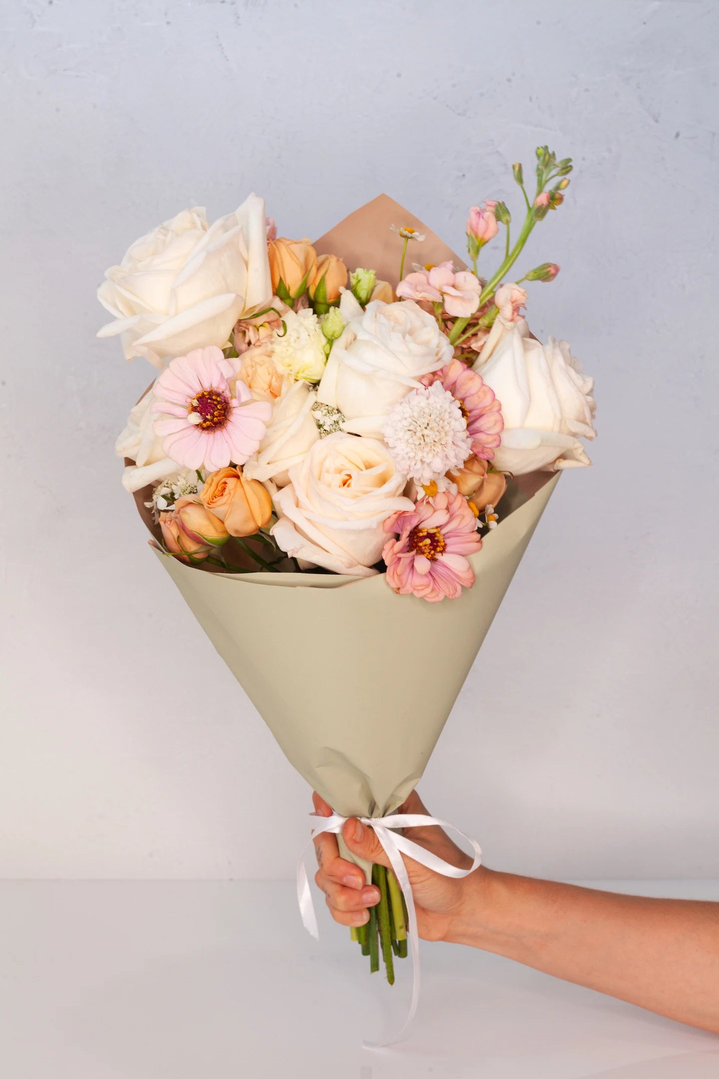 Medium wrapped bouquet with neutral tones. Available for delivery in Austin.