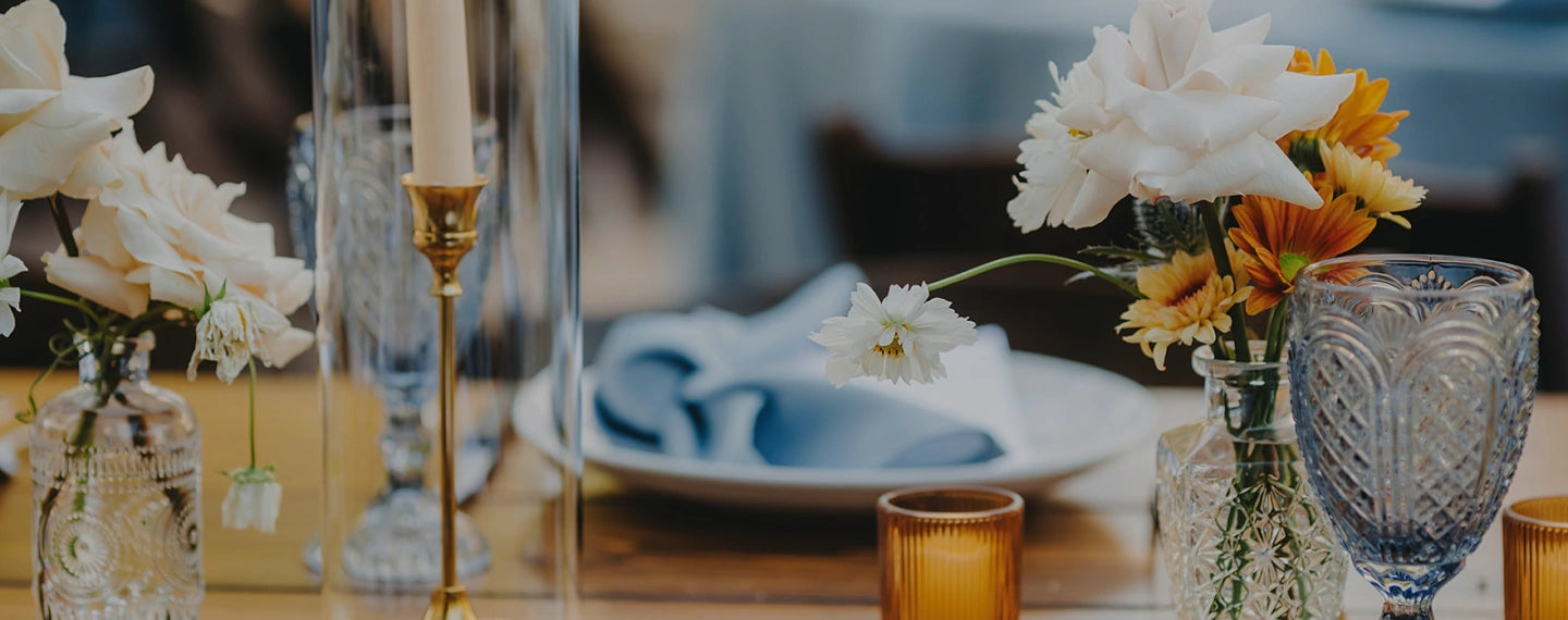 Close-up of wedding settings featuring blue and orange tones.